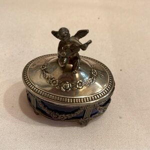 Miniature box made of sterling silver with little angel playing the guitar